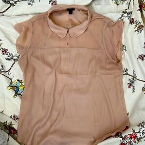Pale peach colored blouse
